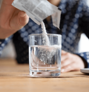 Pouring Sachet of Powder into Drink